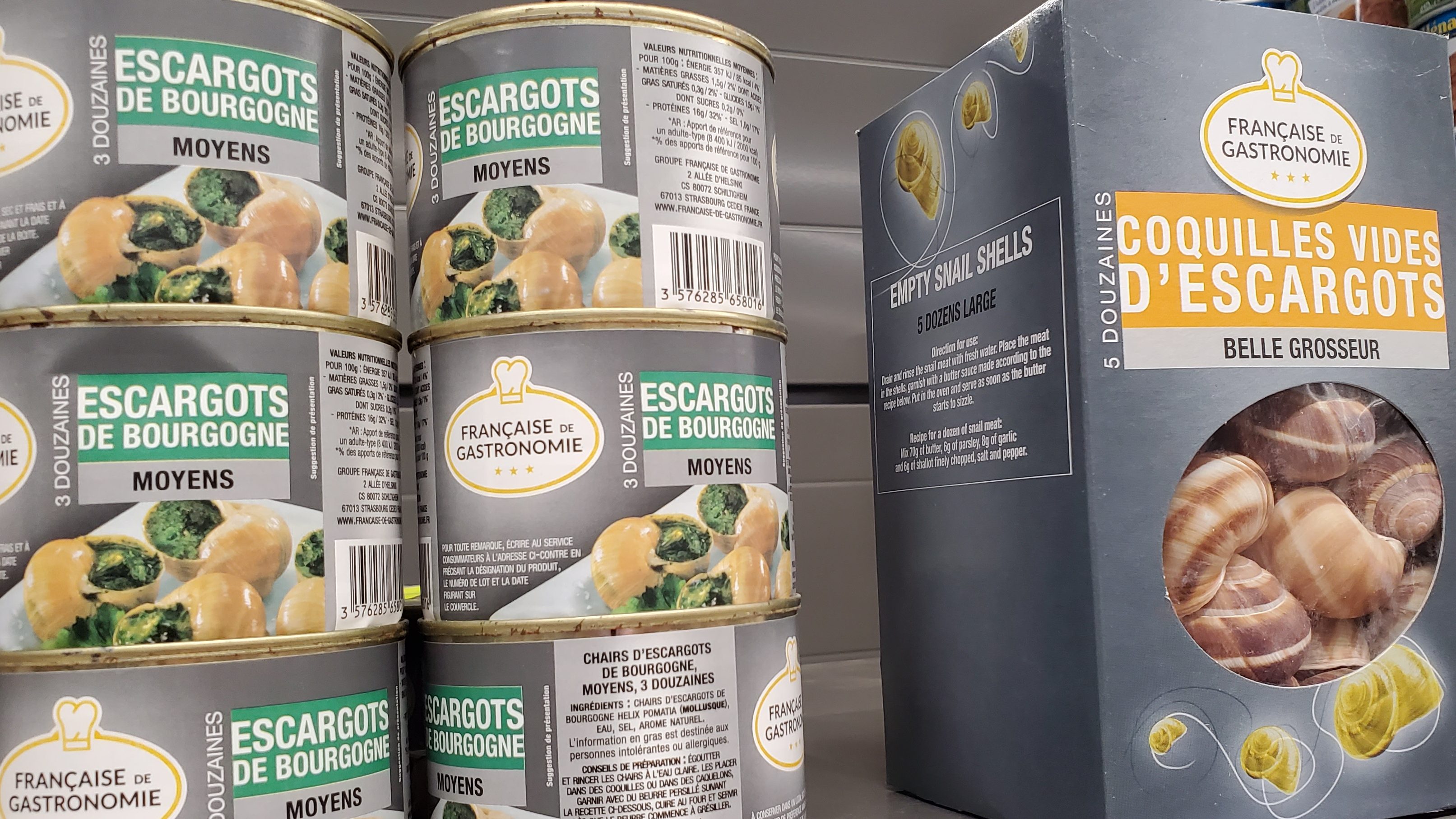 Cans of escargot and box of shells